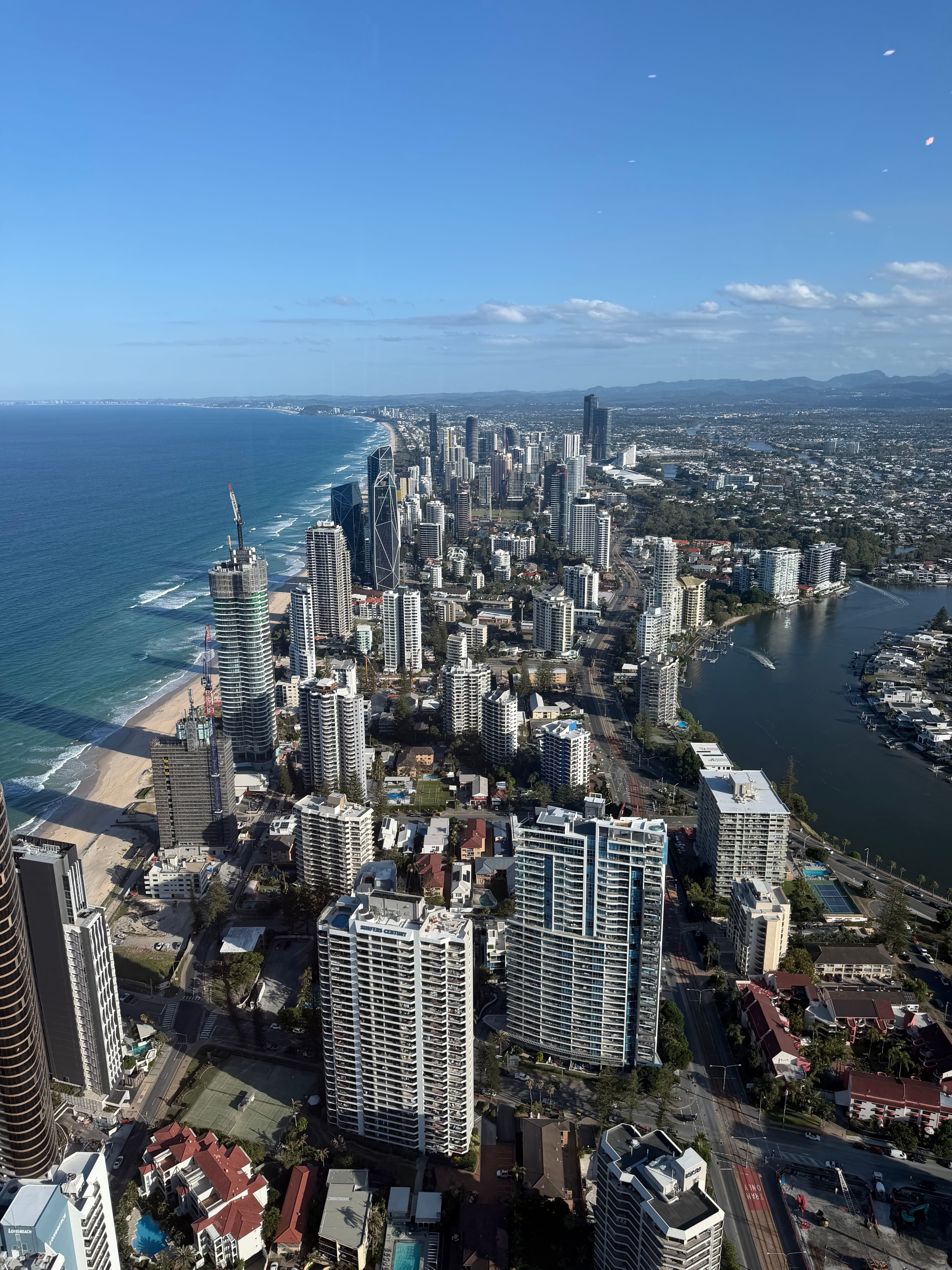 Elevated view of Gold Coast skyscrapers, coastline and waterways in clear daylight